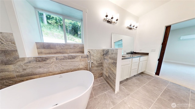 15941 Glenwood Rd SW, Port Orchard, WA 98367 - full bath with double vanity, a freestanding tub, tile walls, and a sink