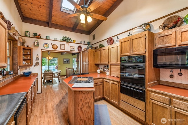 kitchen featuring wood ceiling, black appliances, a peninsula, a warming drawer, and light wood-style flooring