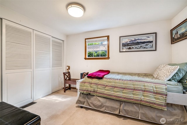 bedroom with a closet, carpet flooring, and visible vents