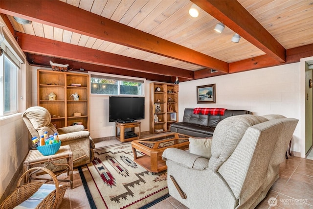 living room with tile patterned flooring, wood ceiling, a wealth of natural light, and beamed ceiling