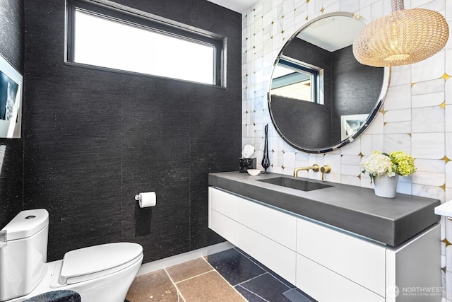 1721 J B George Rd, Walla Walla, WA 99362 - half bathroom featuring toilet, vanity, and tile patterned floors