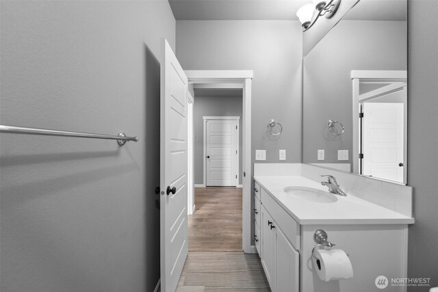 bathroom featuring vanity and wood finished floors