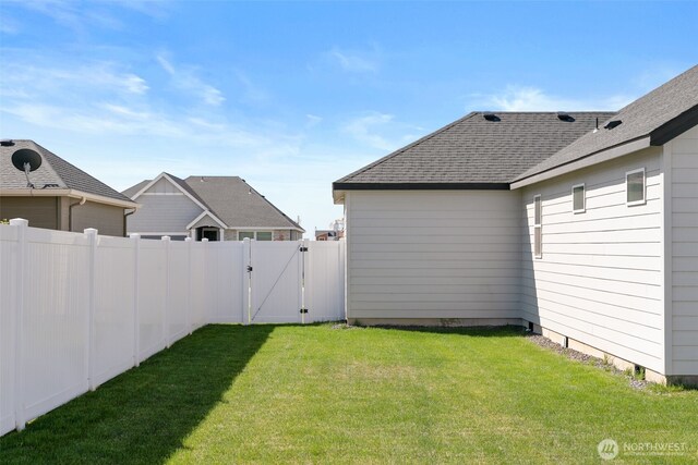 view of yard featuring a gate and fence