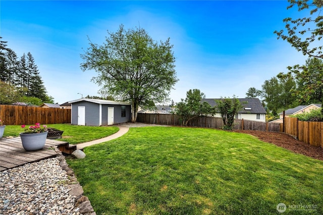 view of yard with an outdoor structure and a deck