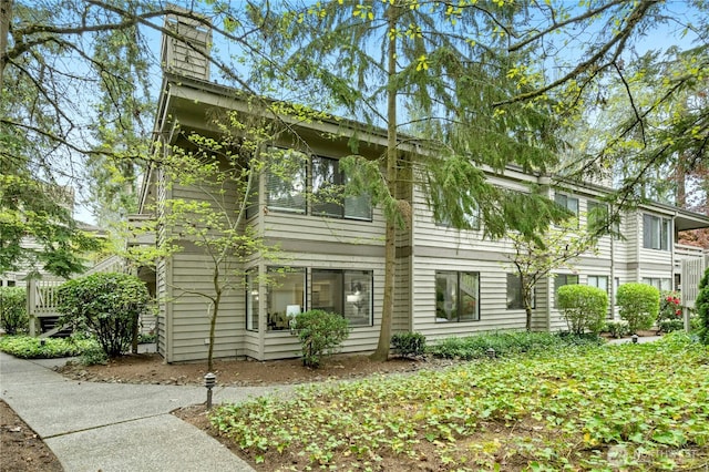 view of front of house featuring a chimney