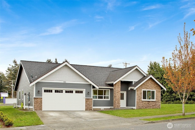 craftsman house featuring a front yard, stone siding, roof with shingles, concrete driveway, and an attached garage