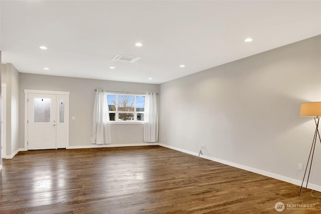 unfurnished living room with baseboards, plenty of natural light, recessed lighting, and wood finished floors