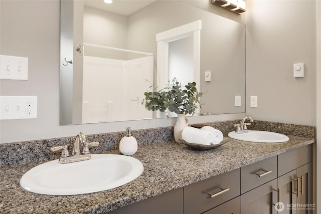 full bath featuring a sink and double vanity