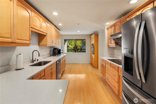 2606 174th Ave NE, Redmond, WA 98052 - kitchen featuring recessed lighting, light countertops, a sink, light wood-style flooring, and appliances with stainless steel finishes