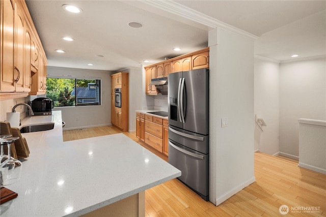 2606 174th Ave NE, Redmond, WA 98052 - kitchen featuring under cabinet range hood, recessed lighting, appliances with stainless steel finishes, and a sink