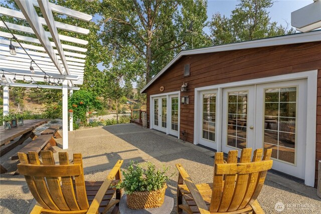 view of patio with a pergola and french doors