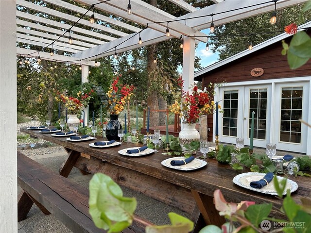 view of patio / terrace featuring a pergola and french doors
