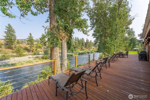deck featuring a water view