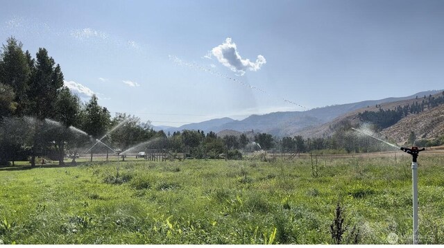property view of mountains featuring a rural view