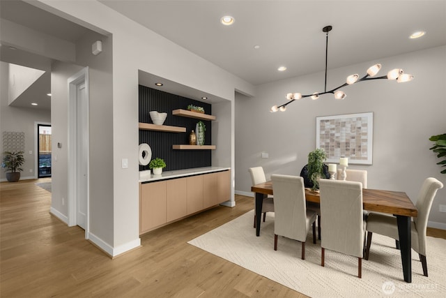 dining room featuring baseboards, recessed lighting, a chandelier, and light wood-type flooring