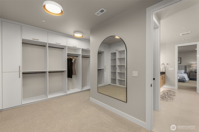 walk in closet with visible vents
