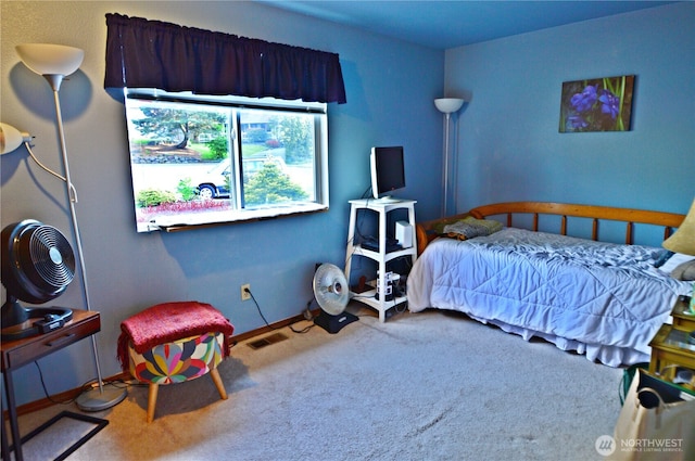 bedroom featuring baseboards, carpet, and visible vents