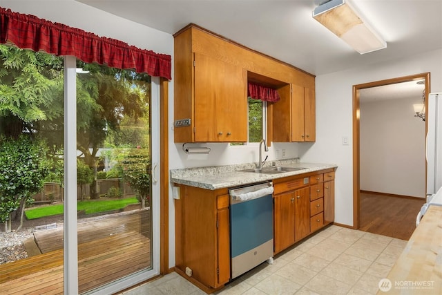 10210 NE 23rd St, Bellevue, WA 98004 - kitchen featuring dishwashing machine, light countertops, brown cabinets, and a sink