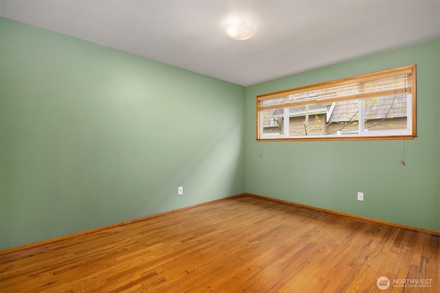 10210 NE 23rd St, Bellevue, WA 98004 - empty room featuring baseboards, wood finished floors, and visible vents