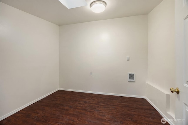 10210 NE 23rd St, Bellevue, WA 98004 - spare room with a skylight, baseboards, wood finished floors, and visible vents