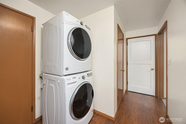 10210 NE 23rd St, Bellevue, WA 98004 - clothes washing area with baseboards, laundry area, wood finished floors, and stacked washer and clothes dryer