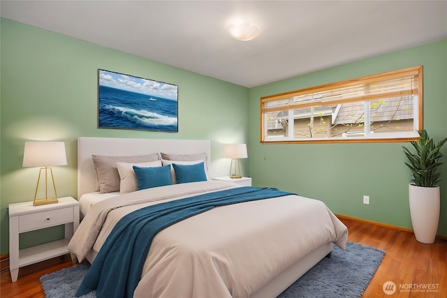 10210 NE 23rd St, Bellevue, WA 98004 - bedroom featuring baseboards and wood finished floors