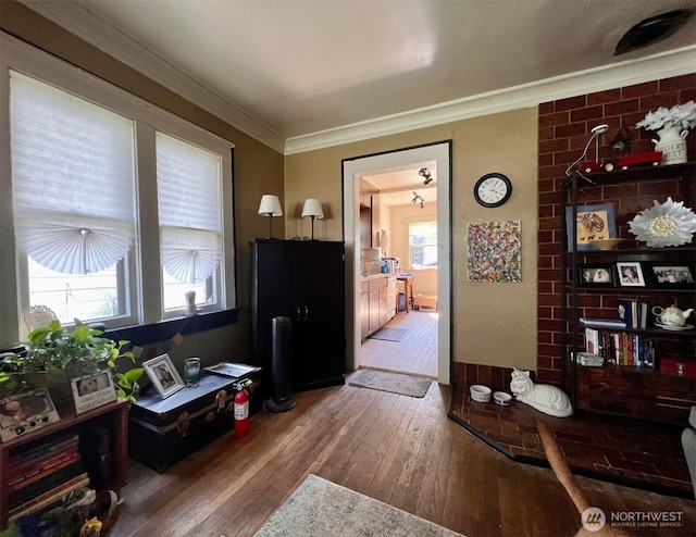 interior space with crown molding and hardwood / wood-style floors