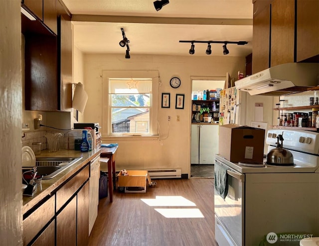 kitchen with electric range, a sink, rail lighting, light wood-style flooring, and a baseboard heating unit