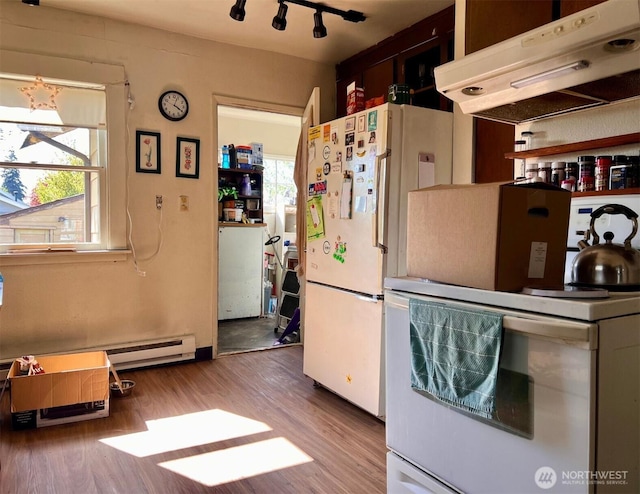 kitchen featuring a baseboard radiator, under cabinet range hood, white appliances, and wood finished floors