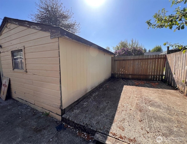 view of side of home with fence