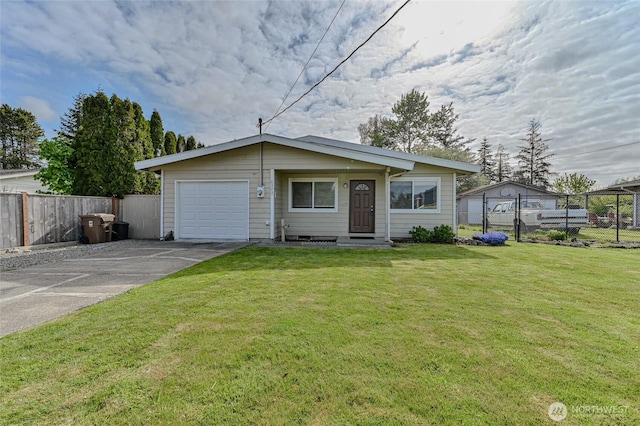 view of front facade with an attached garage, fence, driveway, and a front lawn