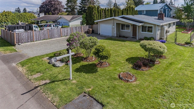 exterior space featuring a front lawn, fence, and concrete driveway