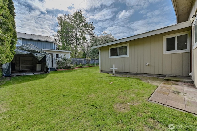 view of yard with fence and a patio