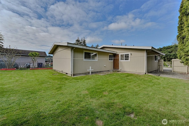 back of property with a yard