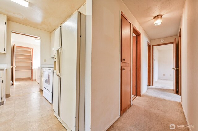 hallway featuring baseboards
