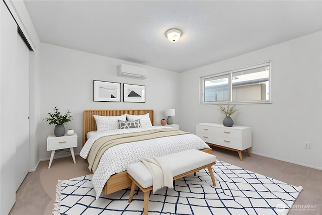 1100 7th Ave SE Unit 12, Puyallup, WA 98372 - bedroom featuring a wall unit AC, light carpet, a closet, and baseboards