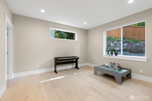 rec room featuring wood finished floors, healthy amount of natural light, recessed lighting, and baseboards