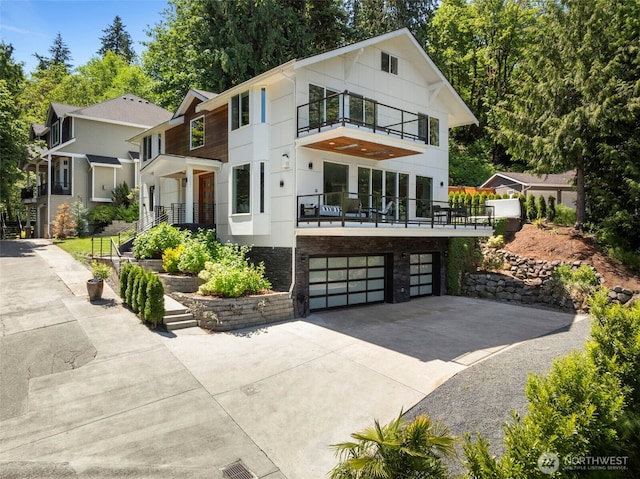 16831 84th Ln NE, Kenmore, WA 98028 - contemporary house with a balcony, a garage, and concrete driveway