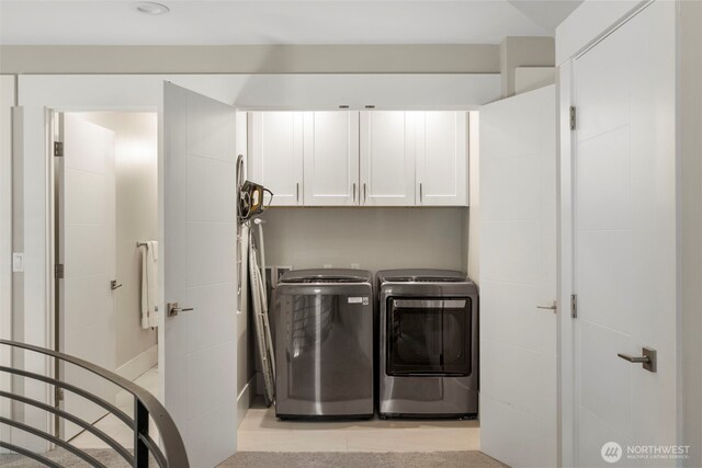 16831 84th Ln NE, Kenmore, WA 98028 - washroom featuring cabinet space and separate washer and dryer