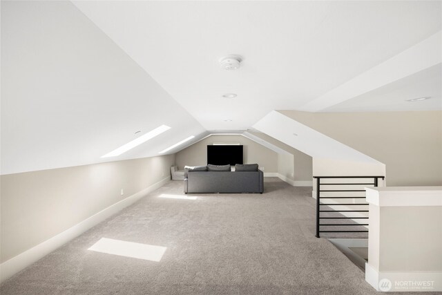 16831 84th Ln NE, Kenmore, WA 98028 - bonus room featuring carpet floors, a skylight, vaulted ceiling, and baseboards