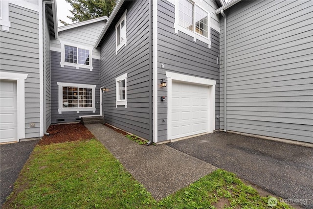 exterior space with a garage
