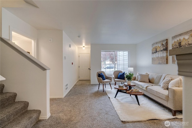 carpeted living room featuring stairs, baseboards, and visible vents