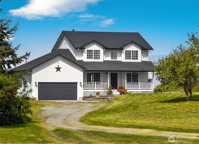 traditional home with covered porch, a garage, a front yard, and dirt driveway