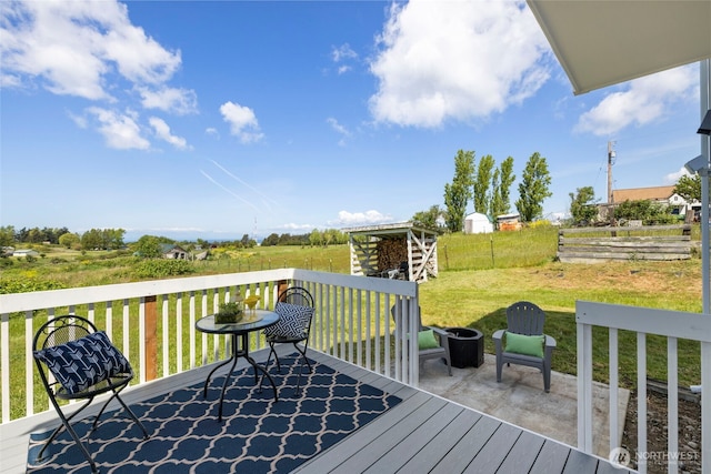 wooden deck featuring a yard