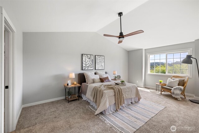 carpeted bedroom with vaulted ceiling, ceiling fan, and baseboards