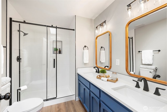 bathroom with toilet and a stall shower