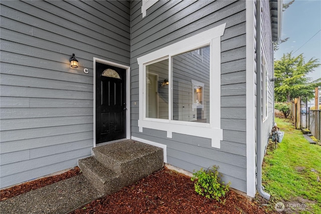 property entrance with fence