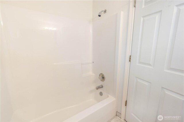 full bath featuring shower / bathing tub combination