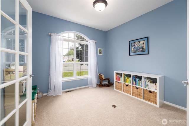 game room with plenty of natural light, carpet, and baseboards