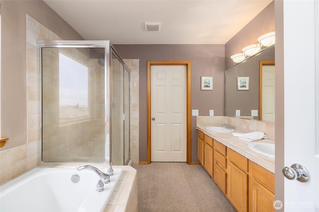 bathroom with visible vents, double vanity, a bath, a sink, and a stall shower